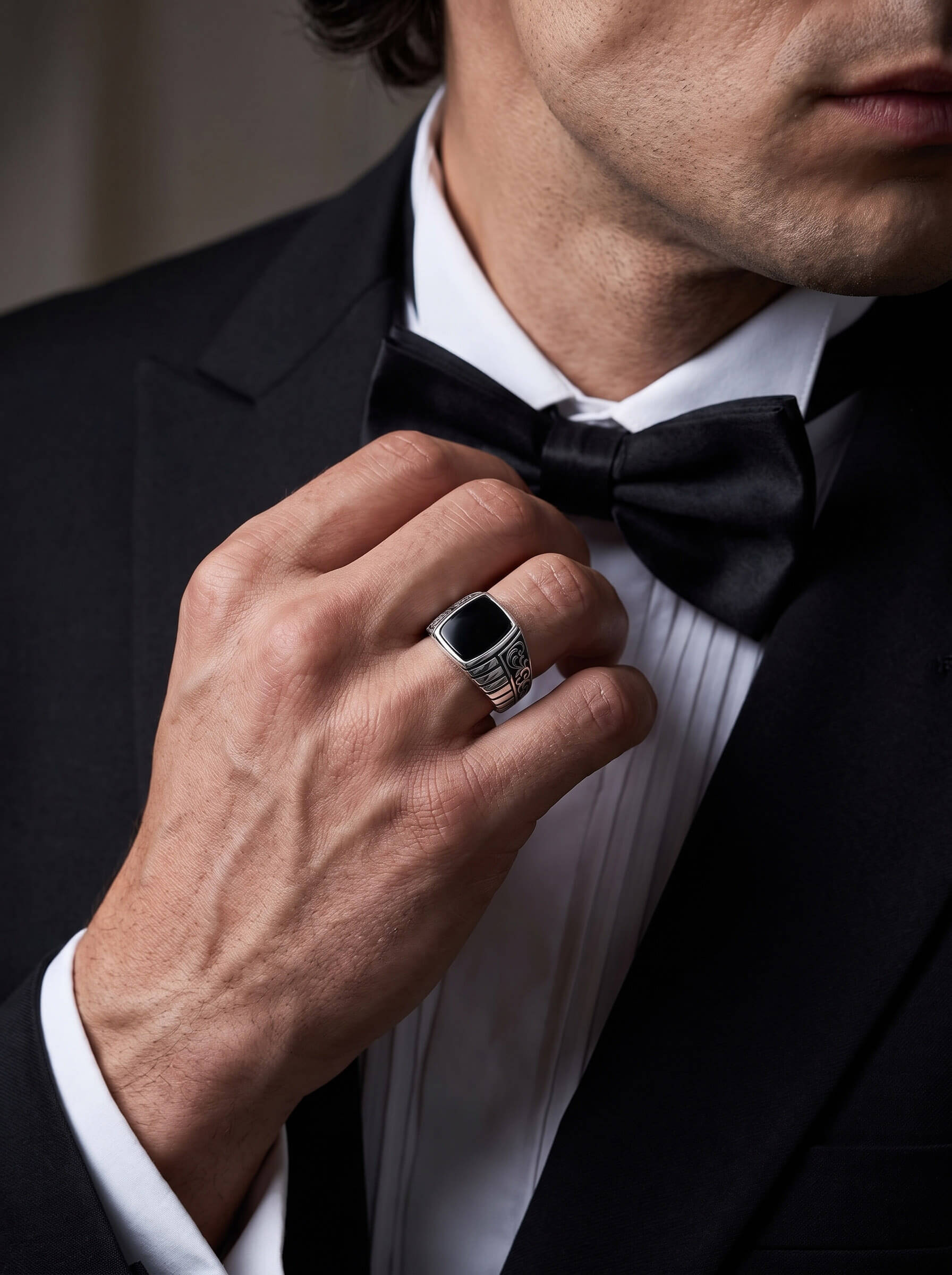 Silver Shadow Ring worn by a man in a black tuxedo while adjusting his bow tie Up To 75% Off Retail