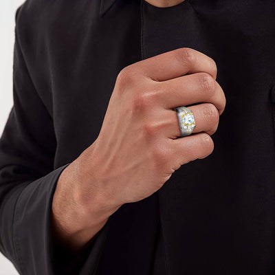 Oxford Men's Ring in sterling silver with a two-tone plating, worn on a man's hand, showcasing a bold and stylish jewelry design.