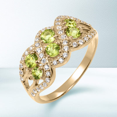 Elegant gold ring featuring vibrant green peridot stones surrounded by sparkling diamonds from the Elysian Peridot Collection with Up To 75% Off Retail.