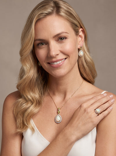 Opal Dew Drop Ring worn by a smiling woman with coordinating opal earrings and necklace Up To 75% Off Retail