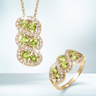 Elegant gold necklace and ring set featuring bright green peridot stones surrounded by sparkling diamonds from the Elysian Peridot Collection, Up To 75% Off Retail.