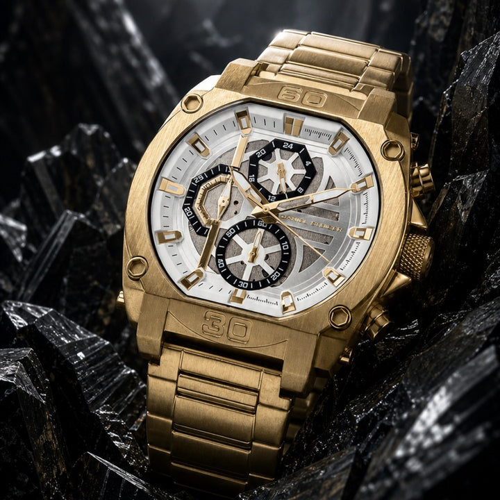 Titan Gold Men's Watch featuring a bold gold-tone metal bracelet and intricate multi-dial white and black face, combining luxury and precision with Up To 75% Off Retail. Daniel Steiger Titan Gold Men's Watch