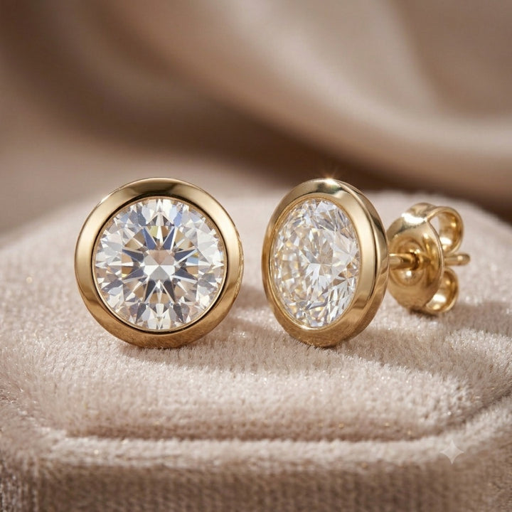 Luxe Solitaire Earrings featuring sterling silver with gold plating, showcasing sparkling solitaire stones on a soft beige fabric background, Up To 75% Off Retail.
