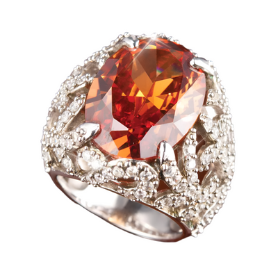 Fire Cocktail Ring featuring a large amber-colored gemstone set in sterling silver with intricate rhodium-plated detailing, designed for women’s jewelry collections.