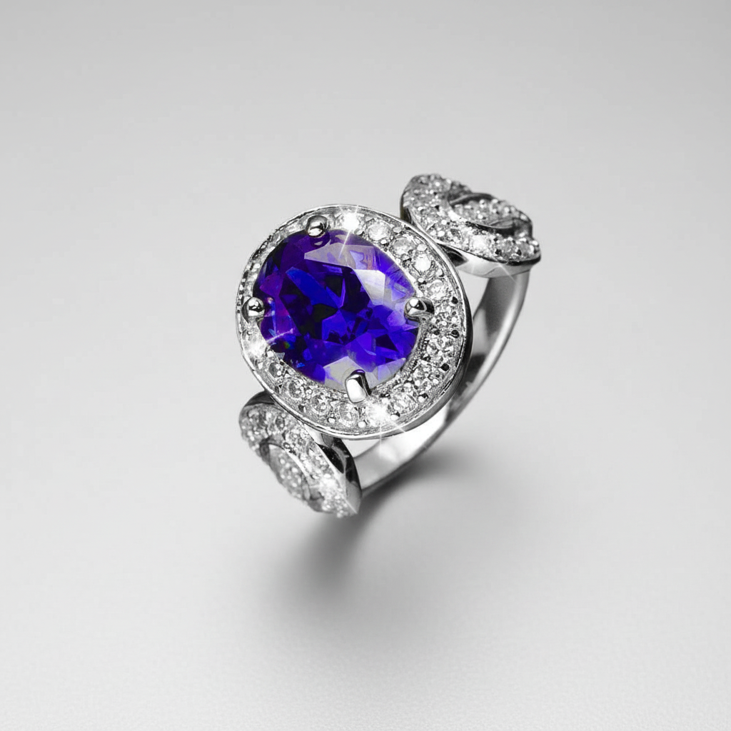 Olivia Ring featuring a sterling silver band with gold plating, adorned with a large purple gemstone centerpiece surrounded by sparkling clear stones, designed for females.