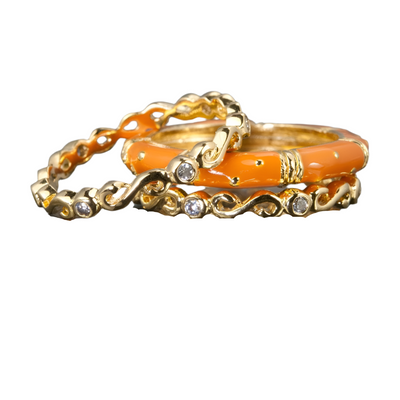 Ming Enamel Stacker Terracotta Rings featuring sterling silver and gold plating with terracotta enamel and small sparkling stones, designed for women’s jewelry collections.