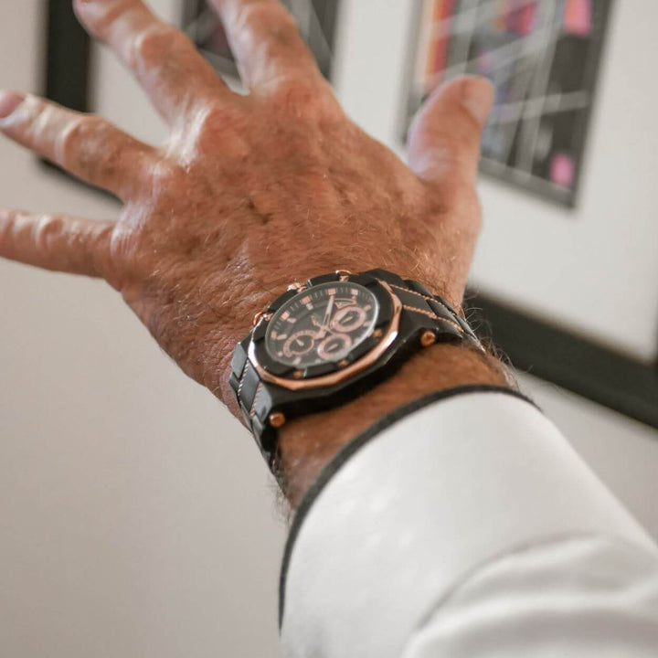 Phantom Black Men's Watch with a stainless steel two-tone design and black dial, stylishly worn on the wrist, showcasing luxury craftsmanship for men’s watches and jewelry.