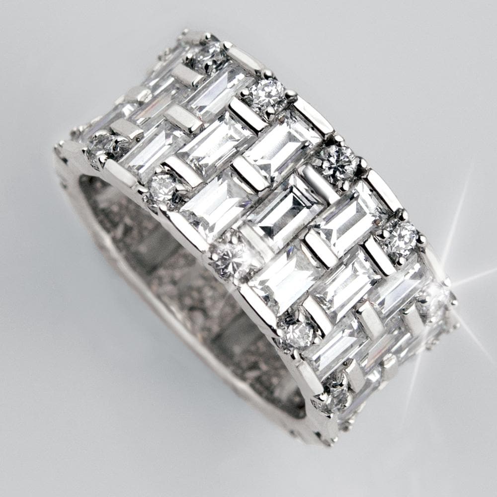 Baguette Eternity Ring featuring sterling silver with rhodium plating, adorned with a continuous row of rectangular and round clear stones, designed for female jewelry enthusiasts.