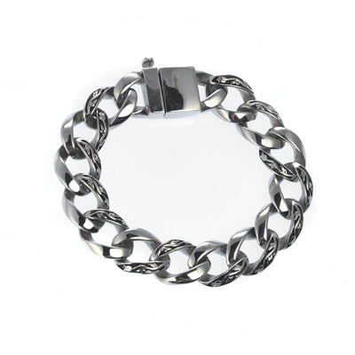 Enigma Steel Bracelet featuring a polished stainless steel chain with intricate link details, designed for a bold, masculine look in men's jewelry.