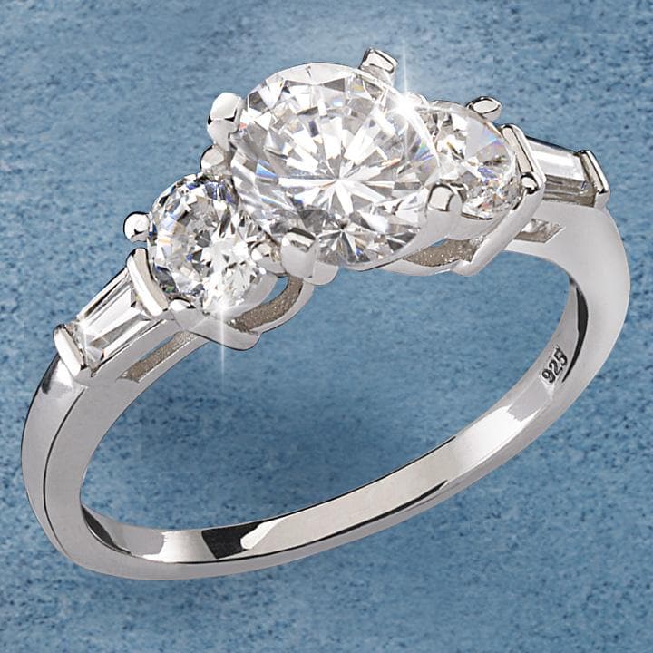Dazzling Delight Ring featuring a sterling silver band adorned with sparkling clear stones, designed as an elegant jewelry piece for women.