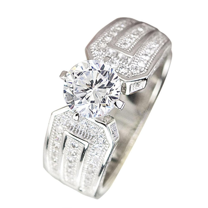 5th Avenue Rhodium Ring featuring a sterling silver band with intricate detailing and a large round clear gemstone centerpiece designed for women’s jewelry.