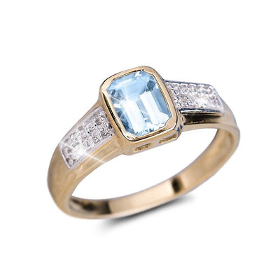 Oseaan Aquamarine Ring featuring a rectangular aquamarine gemstone set in sterling silver with gold plating and adorned with small clear stones, designed for women.