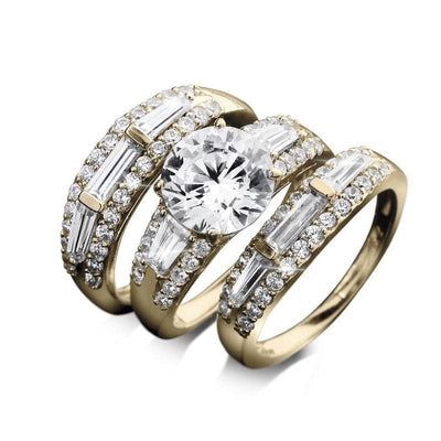 Close-up of three intricately designed Bali Golden Bridal Ring pieces for female, crafted in sterling silver with gold plating, featuring sparkling clear stones arranged in rows including a large central round cut gemstone.