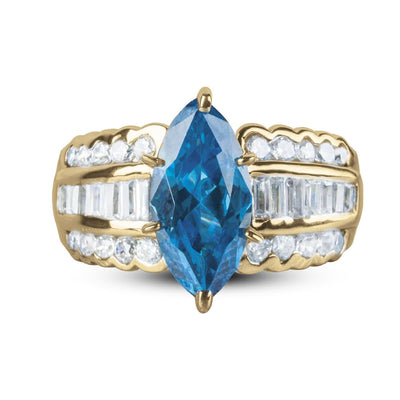 Carman Marquise Ring featuring a gold-plated stainless steel band with a large blue marquise-cut center stone and rows of clear accent stones on each side, designed for women.