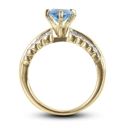 Carman Marquise Ring featuring a gold-plated stainless steel band with a prominent blue marquise-cut gemstone, designed for women’s elegant jewelry collections.