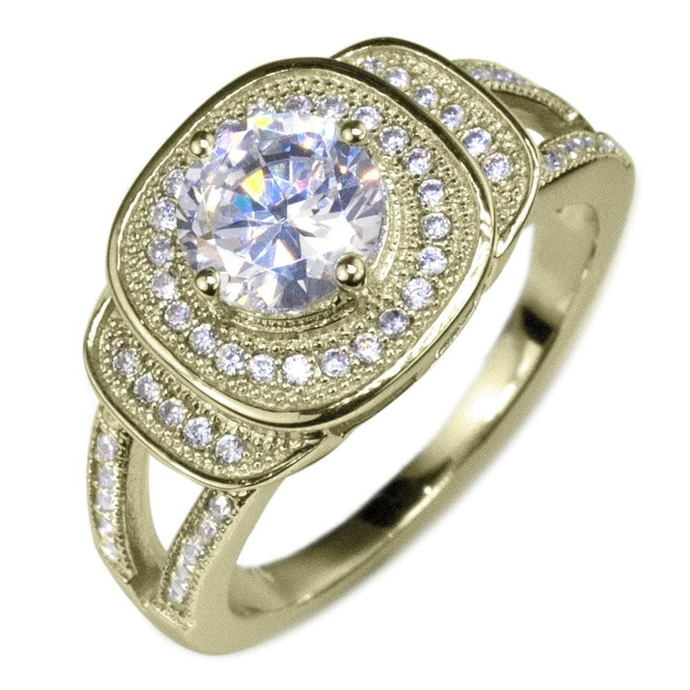 Isobella Gold Ring featuring a sterling silver band with gold plating, adorned with a sparkling central gemstone surrounded by smaller crystals, designed for women’s jewelry.