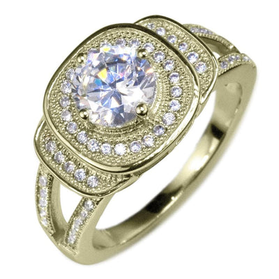 Isobella Gold Ring featuring a sterling silver band with gold plating, adorned with a sparkling central gemstone surrounded by smaller crystals, designed for women’s jewelry.