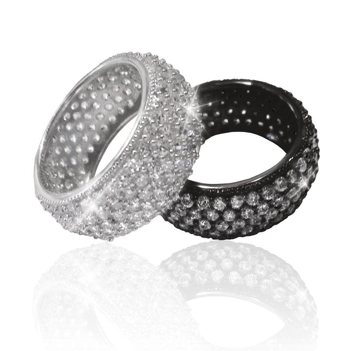 Close-up of two elegant rings featuring a sparkling design, including the Dash Black Rhodium Ring made of sterling silver with rhodium plating, designed for women’s jewelry collections.