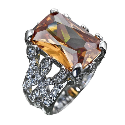 Honeysuckle Ring featuring a large rectangular amber gemstone set in sterling silver with rhodium plating, adorned with intricate detailing and small sparkling accents, designed for women.