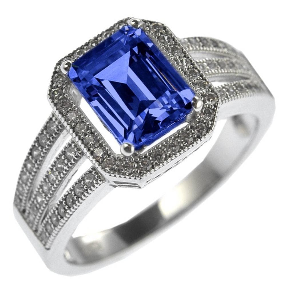 Artica Sapphire Ring featuring a radiant rectangular blue sapphire set in sterling silver with rhodium plating, designed for women’s elegant jewelry collections.