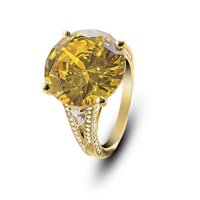 Golden Sun-Drop Ring featuring a large golden yellow gemstone set in sterling silver with gold plating, designed for women’s jewelry collections.