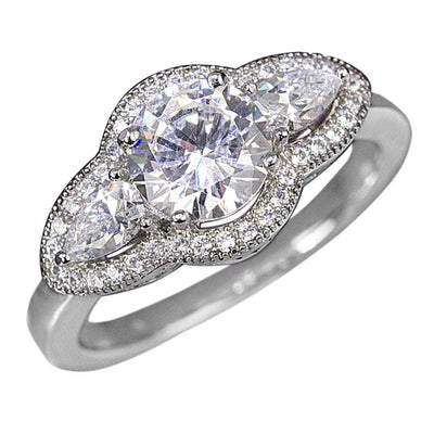 Oleander Ring crafted in sterling silver with rhodium plating, featuring a large round center stone flanked by two pear-shaped stones and surrounded by a halo of smaller sparkling gems.