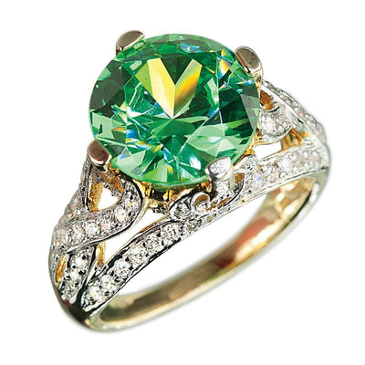 Sterling silver and gold plated Fauna Ring featuring an intricate design with sparkling clear stones and a large round green gemstone centerpiece for female jewelry.