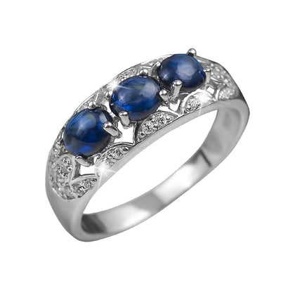 Sterling silver Berry Sapphire Ring for female featuring three blue sapphire stones set in a rhodium-plated band with intricate detailing and small accent diamonds.