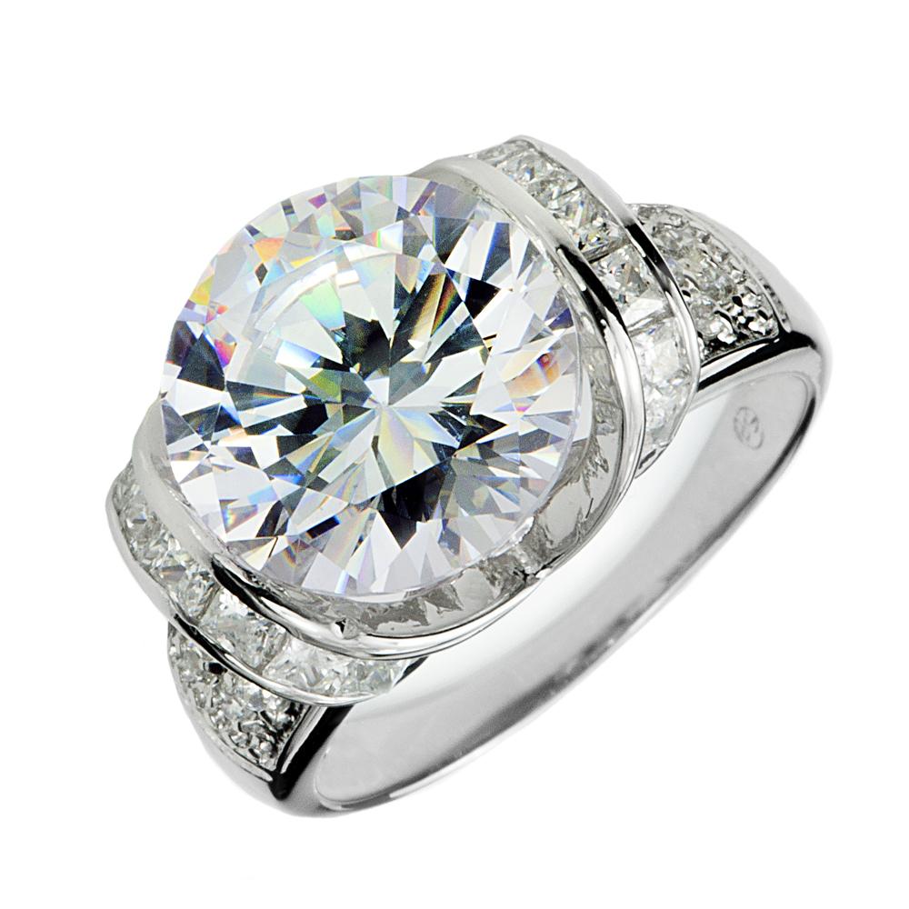 Ultima Ring featuring a large round center stone with smaller stones set in a sterling silver band plated in rhodium, designed for women’s fine jewelry.
