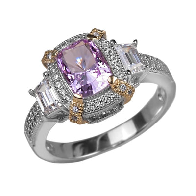 Dahlia Blossom Ring featuring a sterling silver two-tone band with a central cushion-cut light purple gemstone and accented by clear emerald-cut stones and pavé details.