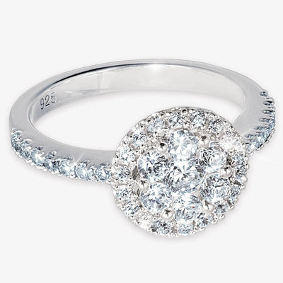 Madeleine Ring in sterling silver featuring a round cluster of sparkling clear stones with additional stones set along the band, designed for women’s jewelry.