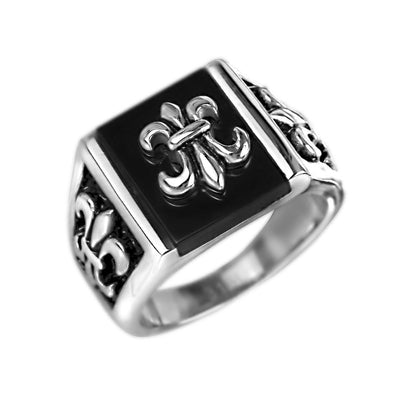 Grand Canyon Steel Ring featuring a bold stainless steel design for men with intricate fleur-de-lis details on a black square face, perfect masculine jewelry piece.