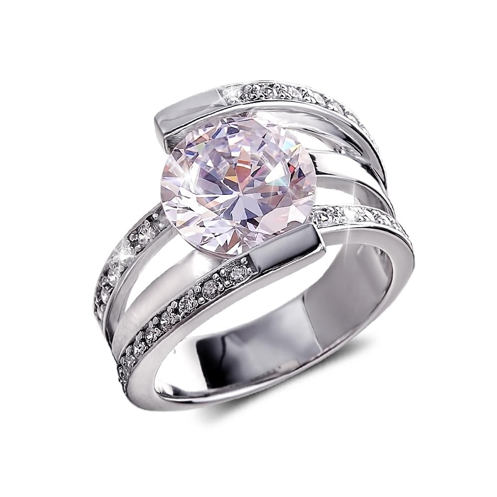 Rodela Rhodium Ring featuring a sterling silver band with rhodium plating, adorned with a large central clear gemstone and smaller accent stones, designed for women.