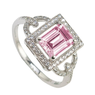Astoria Pink Ring featuring a sterling silver band with rhodium plating, showcasing a square-cut pink gemstone surrounded by sparkling clear stones, designed for women’s jewelry.