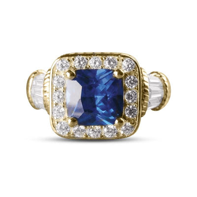 Princesa Azul Ring featuring a sterling silver band with a large blue gemstone centerpiece surrounded by sparkling clear stones, designed for women’s jewelry.