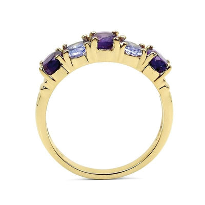 Dafina Tanzanite Ring featuring sterling silver band plated in gold with alternating purple and light blue tanzanite gemstones, designed for women’s elegant jewelry collection.