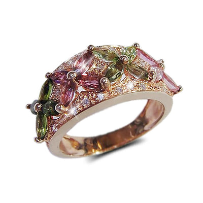Tourmaline Fleur Ring featuring sterling silver with rose gold plating, adorned with multicolored tourmaline gemstones shaped like delicate flowers, designed for women’s jewelry.