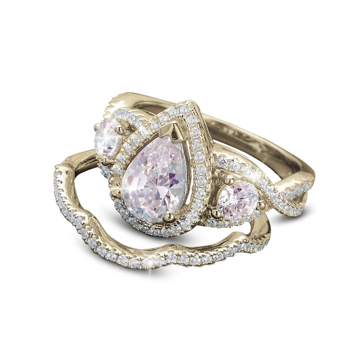 Sterling silver Louis Duo Ring for female, gold plated with a pear-shaped pink center stone and two smaller round pink stones, accented with sparkling crystals.