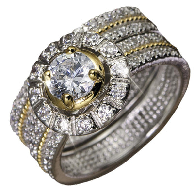 Antonia Ring featuring a two-tone sterling silver design with a central round sparkling gemstone surrounded by smaller clear stones, crafted for women’s jewelry collection.