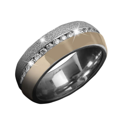 Santo Ring featuring a unisex design in stainless steel with gold plating and a band of sparkling stones, combining elegance and modern style for jewelry collectors.