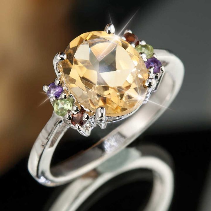 Verdi Citrine Ring featuring a large oval citrine gemstone set in rhodium-plated sterling silver with small colorful accent stones, elegant female jewelry piece.