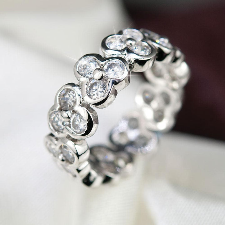 Vienna Eternity Ring crafted in sterling silver with rhodium plating, featuring a continuous floral-inspired design set with clear sparkling stones for elegant female jewelry.